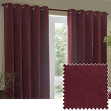 Heavy chenille velvet eyelet curtains in deep beetroot red hanging by a window, showing metal eyelet rings and a fabric swatch inset of the pile texture.