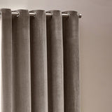 Heavy Chenille Velvet Lined Eyelet Curtains in greige, close-up of silver eyelet rings on a metal rod against a neutral wall.