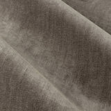 Close-up of heavy chenille velvet eyelet curtain fabric in greige, showing soft draped folds with a subtle sheen and woven polyester texture.