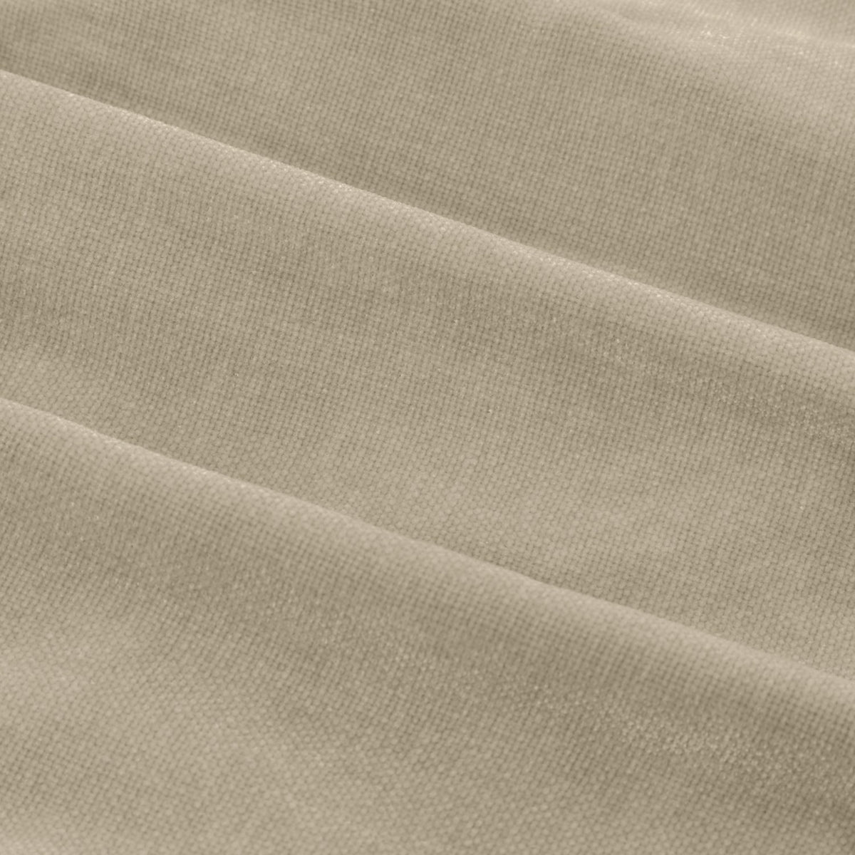 Close-up of Heavy Chenille Linen Lined Eyelet Curtains in linen beige, showing soft, matt chenille weave fabric falling in deep, weighted folds.