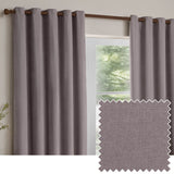 Heavy chenille velvet eyelet curtains in mauve, fully lined, hung on a wood pole beside a window, with a fabric swatch inset showing the woven texture.