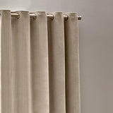 Heavy Chenille Velvet Lined Eyelet Curtains in natural beige, showing soft folds with subtle woven texture on a metal pole with eyelet rings, against a plain grey background.