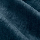 Close-up of heavy chenille velvet eyelet curtain fabric in deep navy, showing soft draped folds and a dense pile with subtle sheen variations.