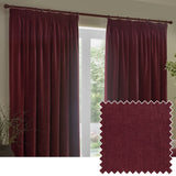 Heavy chenille velvet pencil pleat curtains in deep beetroot red, hung on a pole in a living room window, with a matching fabric swatch shown inset.