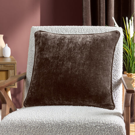 Brown Heavy Chenille Velvet Cushion with square shape and short pile finish, shown on a boucle armchair in a living room setting.