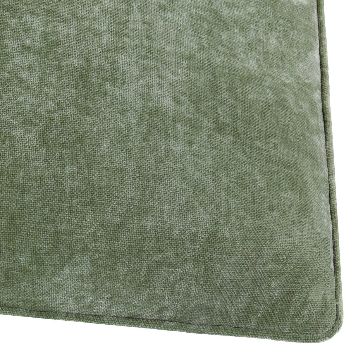 Close-up of the Heavy Chenille Plain Velvet Cushion in eucalyptus green, showing the dense textured fabric and piped edge along the corner.