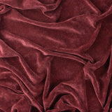 Heavy Chenille Eyelet Velvet Throw in beetroot red, softly draped fabric showing a mottled, wine-dark sheen across its velvet pile.