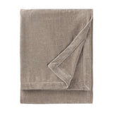 Heavy Chenille Eyelet Velvet Throw in greige, folded to show its dense velvet pile and finished edge trim, on a plain white background.