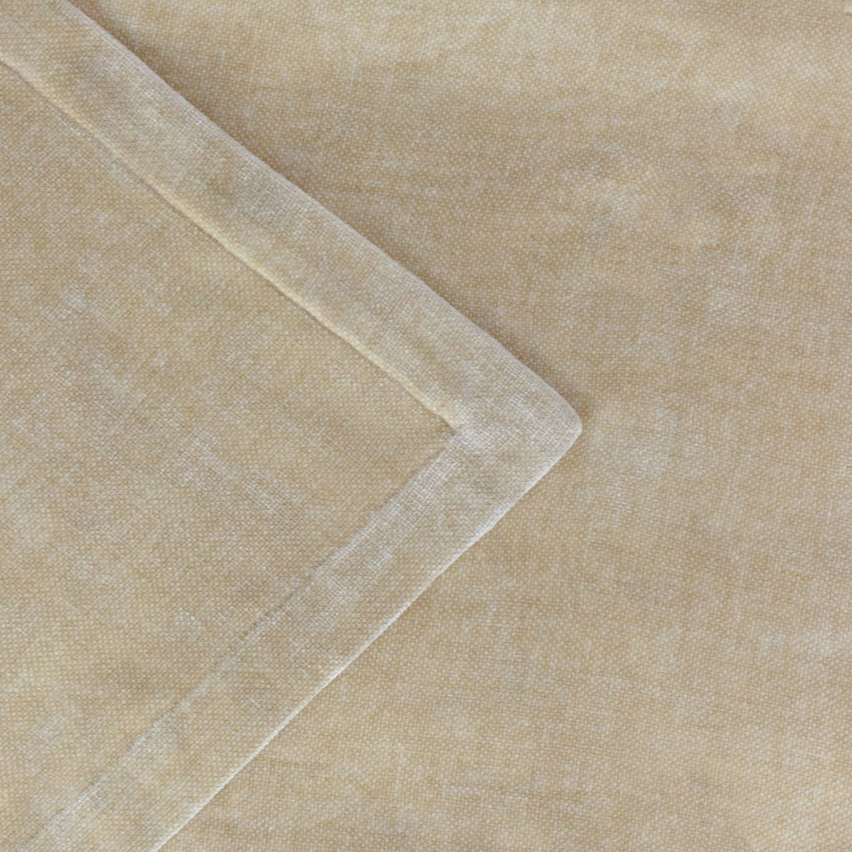 Close-up of the Heavy Chenille Eyelet Linen Throw in beige, showing the plush woven texture and a folded, stitched edge detail.