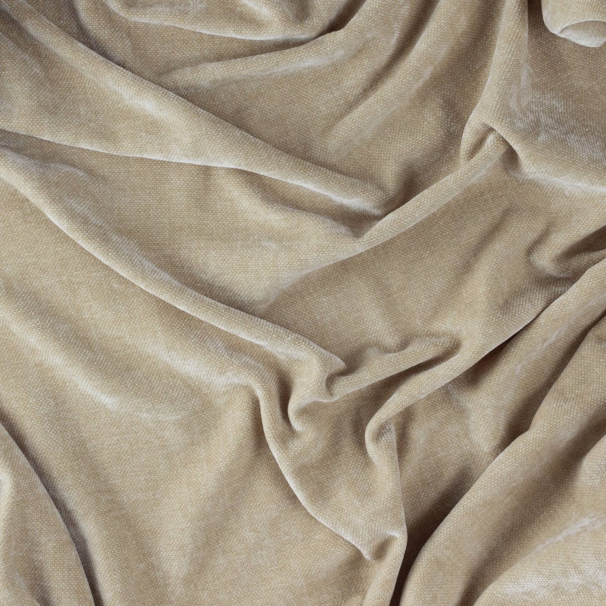Close-up of the Heavy Chenille Eyelet Linen Throw in beige, showing soft draped folds and a dense, velvety chenille texture.