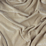 Close-up of the Heavy Chenille Eyelet Linen Throw in beige, showing soft draped folds and a dense, velvety chenille texture.