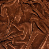 Heavy Chenille Eyelet Velvet Throw in nutmeg brown, close-up showing soft folds and the fabric's tufted pile with a subtle matt-to-lustrous sheen.