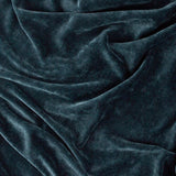 Close-up of the Heavy Chenille Eyelet Velvet Throw in navy, showing the dense velvet nap and soft folds with light catching the fabric's texture.