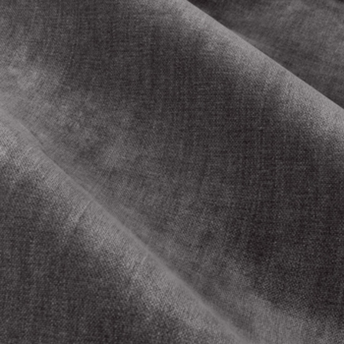 Close-up of heavy chenille velvet eyelet curtain fabric in charcoal, showing dense woven texture and soft draped folds.