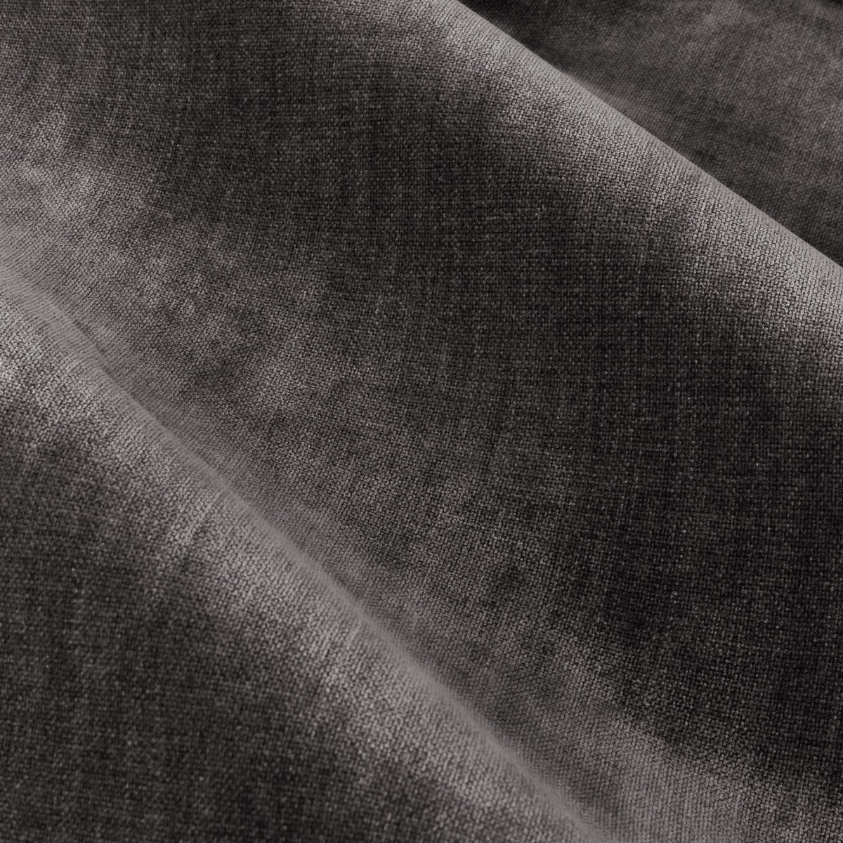 Close-up of heavy chenille pencil pleat curtain fabric in charcoal, showing soft draped folds and a plush, velvety woven texture.