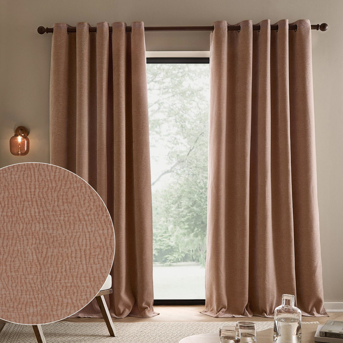 Heath Washed Velvet Jacquard Fully Lined Eyelet Curtains in Cotta pink hung on a dark rod by a window, with a fabric texture close-up shown in the corner.