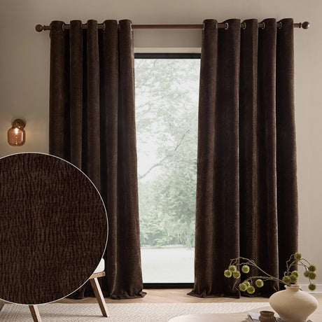 Heath Washed Velvet Fully Lined Eyelet Curtains in espresso brown, textured jacquard weave with brass eyelets, shown framing a window in a living room, with fabric swatch inset.