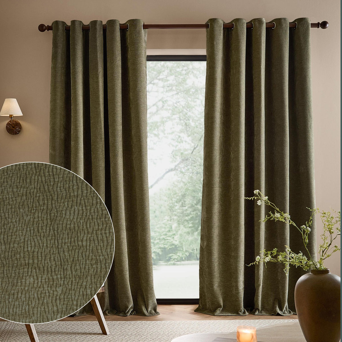 Heath washed velvet eyelet curtains in eucalyptus green hanging fully lined either side of a window, with a fabric texture swatch shown in a living room setting.