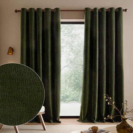 Heath olive green eyelet curtains in washed velvet jacquard hang fully lined on a bronze rod beside a window, with a fabric texture close-up inset.