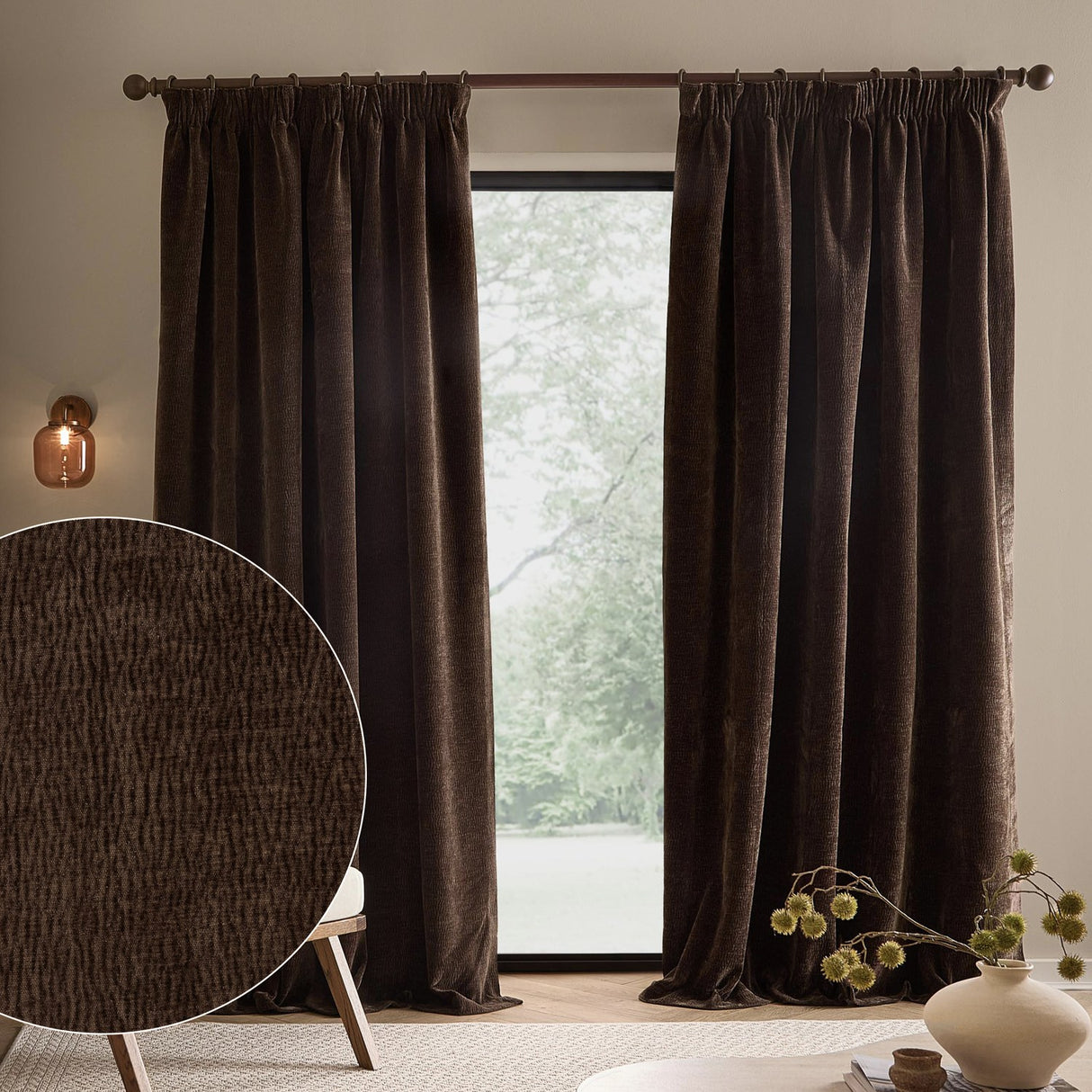 Espresso brown Heath pencil pleat curtains in washed velvet hang beside a window, with a fabric texture swatch shown in the foreground.