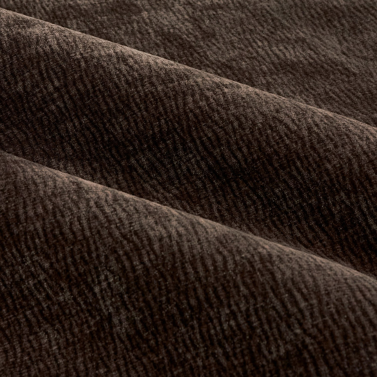 Close-up of Heath Pencil Pleat Curtains in espresso brown, showing enzyme-washed velvet with a subtle jacquard weave texture across soft folds.