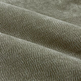 Close-up of Heath Pencil Pleat Curtains in Eucalyptus, showing draped enzyme-washed velvet fabric with a subtle jacquard weave texture in soft olive green.
