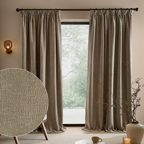 Heath Washed Velvet Pencil Pleat Curtains in greige hang pencil-pleated on a dark pole either side of a window, with a fabric texture swatch shown inset in a living room setting.