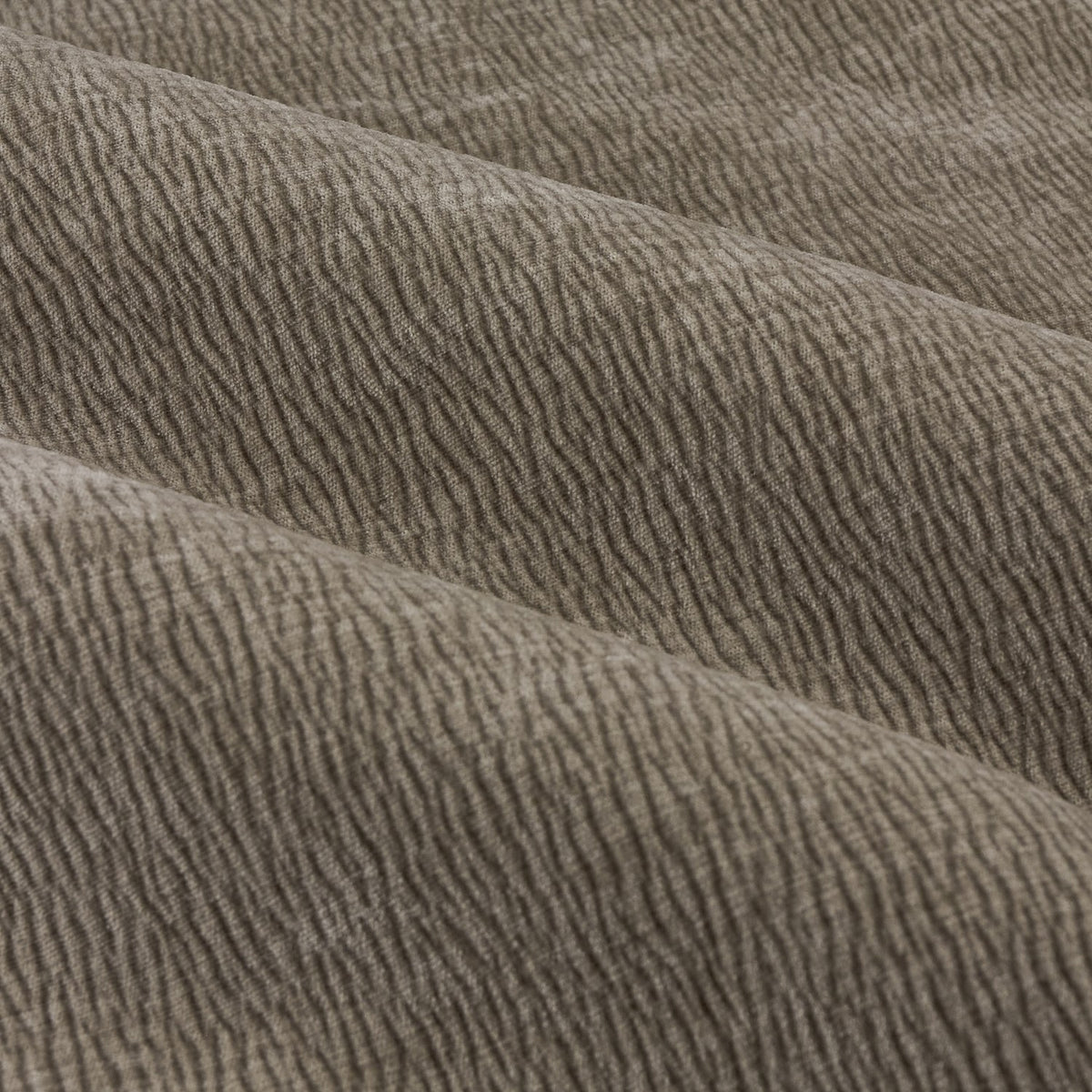 Close-up of Heath Pencil Pleat Curtains fabric in greige, showing washed velvet with a fine jacquard textured weave and soft folds.