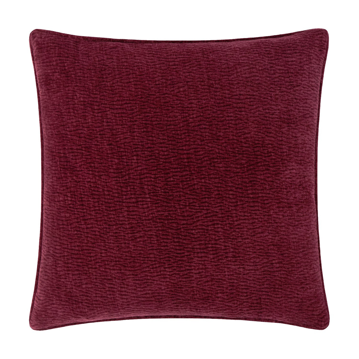 Heath square cushion in deep beetroot red washed velvet with a jacquard-textured surface and piped edge, shown on a plain white background.