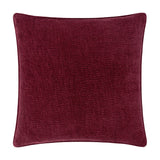 Heath square cushion in deep beetroot red washed velvet with a jacquard-textured surface and piped edge, shown on a plain white background.