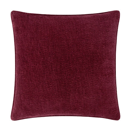 Heath square cushion in deep beetroot red washed velvet with a jacquard-textured surface and piped edge, shown on a plain white background.