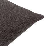 Close-up corner view of the Heath washed velvet jacquard cushion in charcoal, showing textured fabric and piped edge against a white background.