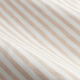 Close-up of the Hebden pencil pleat curtain fabric in blush, showing a diagonal woven-look striped pattern in cream and soft pink on lightweight cotton.