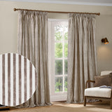 Hebden fully lined cotton pencil pleat curtains in chocolate brown and cream stripe, hung on a wooden pole beside a window in a living room setting.