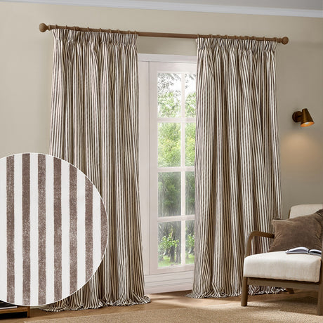 Hebden fully lined cotton pencil pleat curtains in chocolate brown and cream stripe, hung on a wooden pole beside a window in a living room setting.