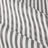 Close-up of Hebden Pencil Pleat Curtains in grey, showing a vertical grey-and-white striped cotton fabric with a soft, slightly slubbed ticking-style texture.