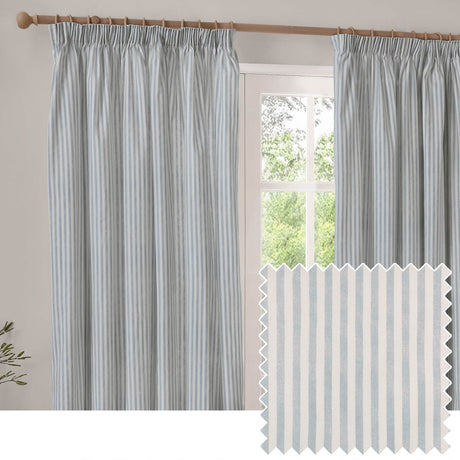 Hebden fully lined cotton pencil pleat curtains in mineral blue stripe, hung on a wooden pole beside a window, with a fabric swatch shown below.