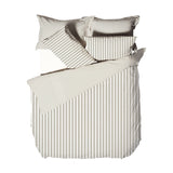 Hebden Cotton Striped Duvet Cover Set in Natural, showing folded cotton bedding with beige and cream mélange stripes and matching pillowcases on a white background.