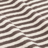 Close-up of Hebden Striped Cotton Towel in chocolate brown, showing woven terry towelling with vertical stripes against a soft cream ground.