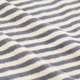 Close-up of Hebden Striped Cotton Towels in mineral blue, showing woven terry cloth with even vertical stripes against a cream ground.