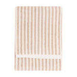 Folded Hebden cotton towel with vertical beige and cream stripes and a plain cream border, shown against a plain white background.