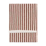 Folded cotton towel with vertical pecan brown and cream stripes and a looped terry pile, shown on a plain white background.