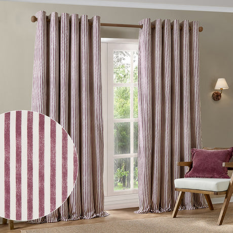 Hebden Cotton Printed Eyelet Curtains in Beetroot, showing a pair of red and cream striped panels with eyelet headings hung from a wooden pole in a living room setting.