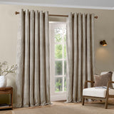 Hebden Cotton Printed Eyelet Curtains in Chocolate, striped brown and cream cotton panels with eyelet header, shown framing a window in a living room setting.