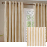 Hebden Cotton Printed Eyelet Curtains in honey yellow and off-white vertical stripe, shown hung on a wooden pole beside a window, with a fabric swatch inset.