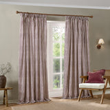 Hebden Striped Cotton Pencil Pleat Curtains in Beetroot, cream fabric with red vertical stripes, gathered header hung on a wooden pole in a living room setting.