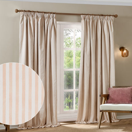 Hebden striped cotton pencil pleat curtains in blush and off-white, shown pencil-pleat headed on a wooden pole in a living room window setting, with fabric swatch inset.