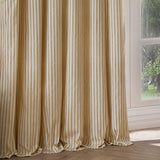 Hebden Striped Cotton Pencil Pleat Curtains in honey yellow and cream, hanging in soft folds beside a glazed door in a light-filled room.