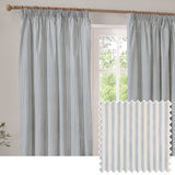 Hebden Striped Cotton Pencil Pleat Curtains in Mineral Blue, shown as a pair with vertical blue-and-white stripes on wooden rings and a pole, framing a window with garden view.