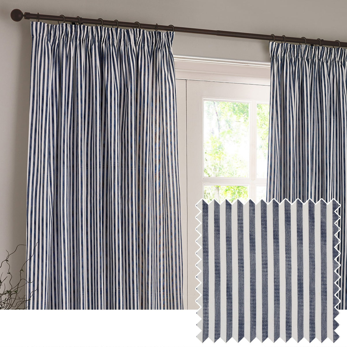 Hebden Striped Cotton Pencil Pleat Curtains in navy and white vertical stripe, hung at a window with a fabric swatch shown inset.
